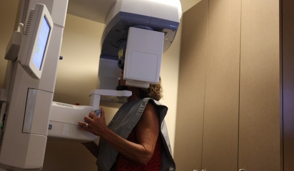 A patient at The Issaquah Dentist in a smile scanning machine