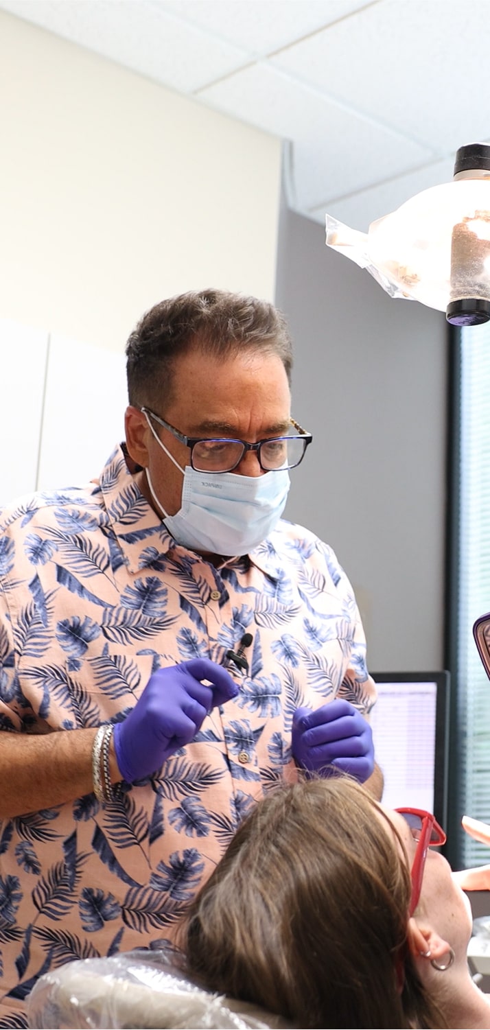 The Issaquah dentist and a smiling patient in a dental chair